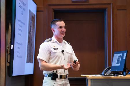 Ben Bowen ’26 explains the underlying driving principles of two of his favorite authors, Edgar Allen Poe and John Gardner, during his honors presentation in Scott Shipp Hall.