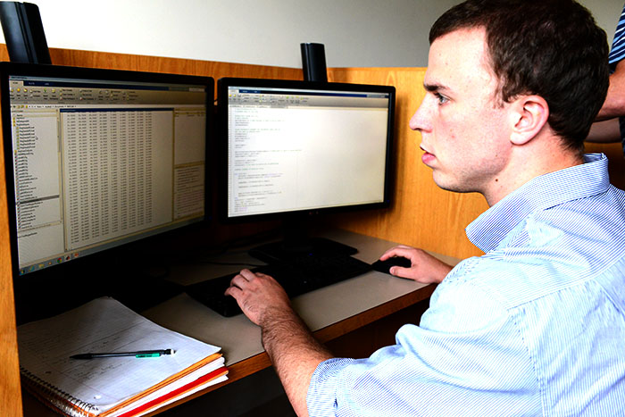 A student looks at a computer