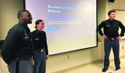 JAMES BANGURA ’26, Katelyn Redlinger ’27, and Gunnar Romsland ’26 review their cyber defense presentation for nonprofits and small local organizations in Rockbridge County. (photo courtesy of Dr. Sherif Abdelhamid)