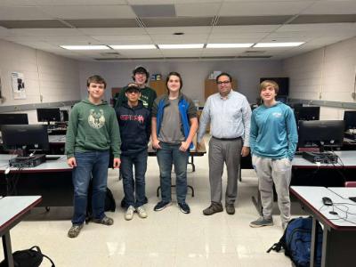 Students pose for a photo with Dr. Sherif Abdelhamid