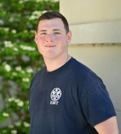 Walker poses for a photo in his EMT uniform.