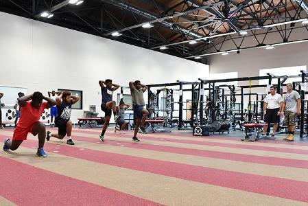 Participants in the College Orientation Workshop (COW) program work on their physical fitness in Cormack Hall.