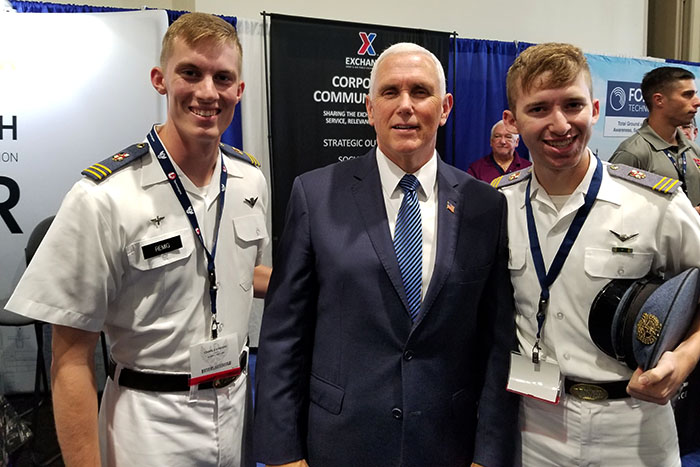 Two cadets stand with Vice President Michael Pence