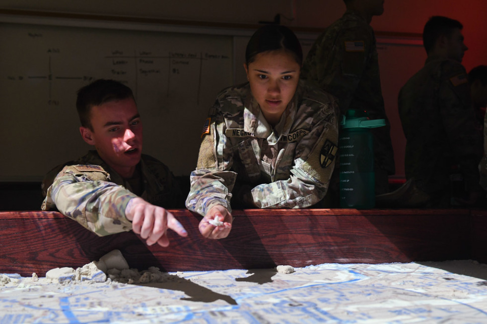 AFROTC cadets review logistics map.