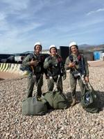 Cadets celebrate their completion of a jump during the Freefall Program at the United States Air Force Academy in Colorado Springs.