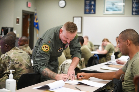 Air Force ROTC staff works with new recruits during matriculation.