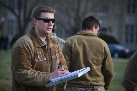 AFROTC cadet with notebook.