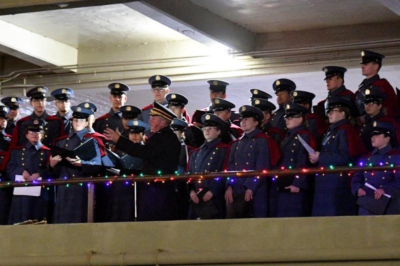 The Glee Club sings carols in the barracks courtyard, 2019