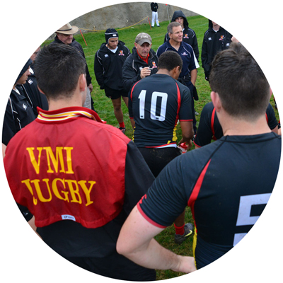 Rugby Club Men’s cadet members circling around on field photo circle