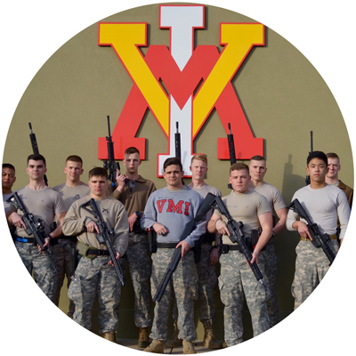 Three Gun Club cadet members group holding rifle, pistol, shotgun in front of wall with large VMI logo photo circle