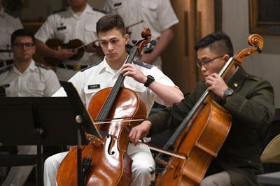 Members of the VMI Commanders Jazz band play on post May 2022
