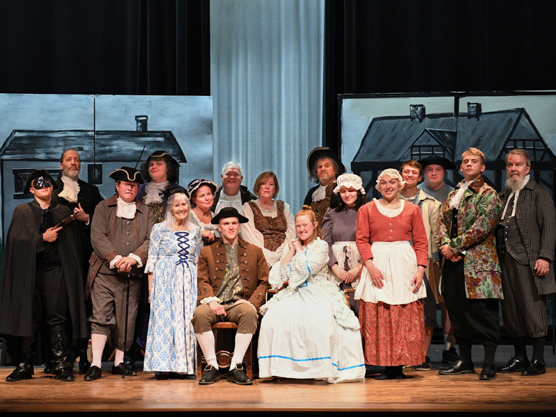 VMI cadets and community cast of Tom Jones in costume on stage for VMI Theatre 50 plus 2 celebration