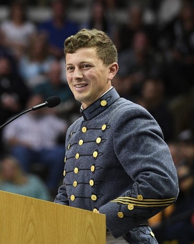 2024 Class President Cole Cathcart addresses the Corps and the crowd in Cameron Hall.