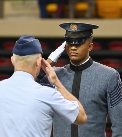 RCO Devin Auzenne '26 salutes the Commandant of Cadets.
