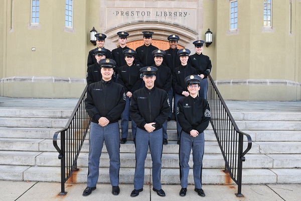 Students (cadets) at VMI who are members of the S-2 staff and serve as academic support to the Corps of Cadets pose in front of Preston Library on campus (post).