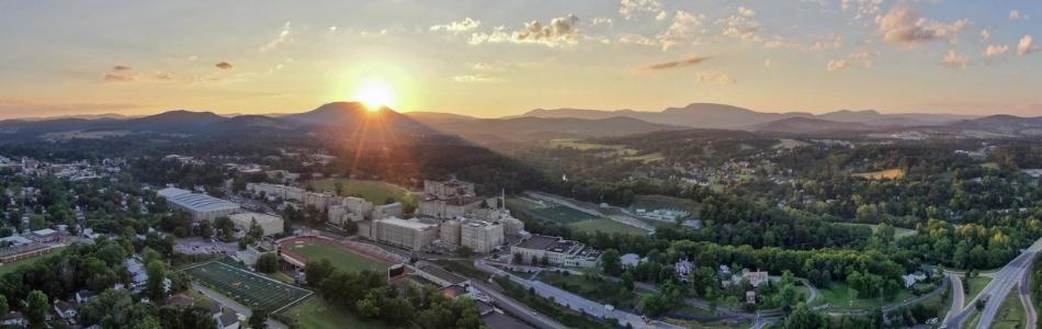 aerial photo of post with sunrise over mountains