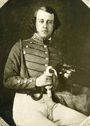 This is a daguerreotype of one of the earliest cadets at VMI, Daniel Powell, in a cadet uniform while holding a saber.