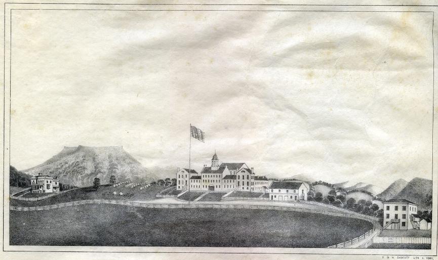 The lithograph is an early view of VMI barracksand additional building from 1847. In the background, there are the Blue Ridge Mountains and House Mountain.