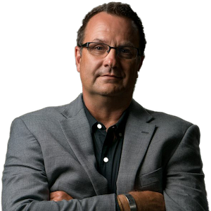 Profile Image of middle-aged caucasian male with glasses in blazer and collared shirt