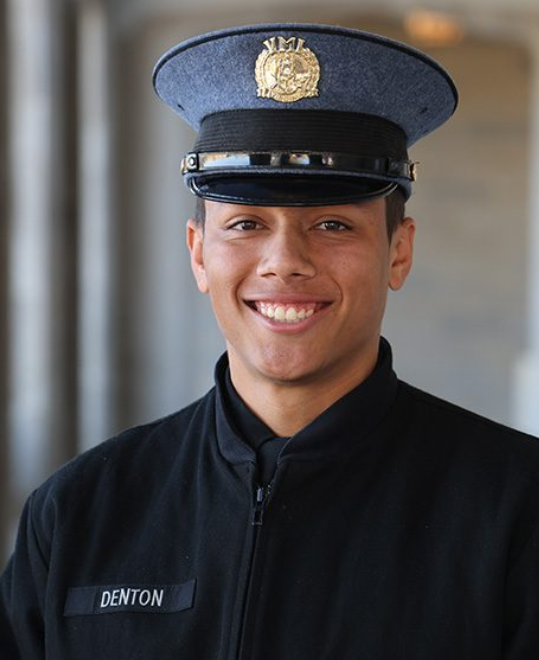 Zachary Denton ’27 poses with a smile along a corridor at VMI.