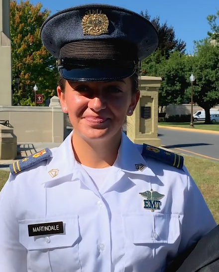 Delilah Martindale walks along Academic Row, with Limits Gates in the background.