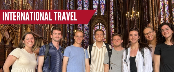 International Travel text overlay on photo of cadets visiting a church in France.