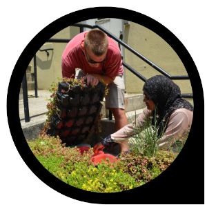 Steele Lamade ’19 and his mentor, Dr. Tanjina Afrin, collecting water samples 