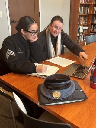 Delilah Martindale discusses her research with mentor Dr. Vera Heuer.