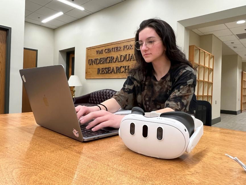 Cadet Nathalie Lavender ’26 works at a computer in the VCUR office space.