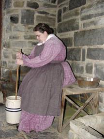 Bushong Homestead at New Market Battlefield - dairy interior with woman churning butter