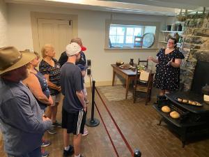 Museum staff leads small group in themed tour
