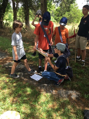 Summer camp attendees gathered in a circle