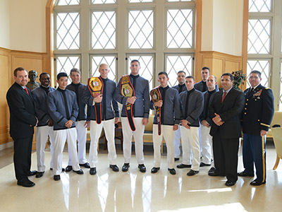 Members of VMI's club boxing team display their championship belts.