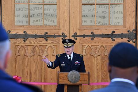 Image of Gen. Peay at lectern in front of Cocke Hall.