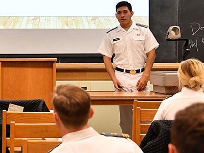 Sebastian Chavez ’17 describes the milkshake business to Maj. Dee Mornah’s entrepreneurship class as his business partner, Anthony Izzo ’17, looks on. – VMI Photo by Kelly Nye.