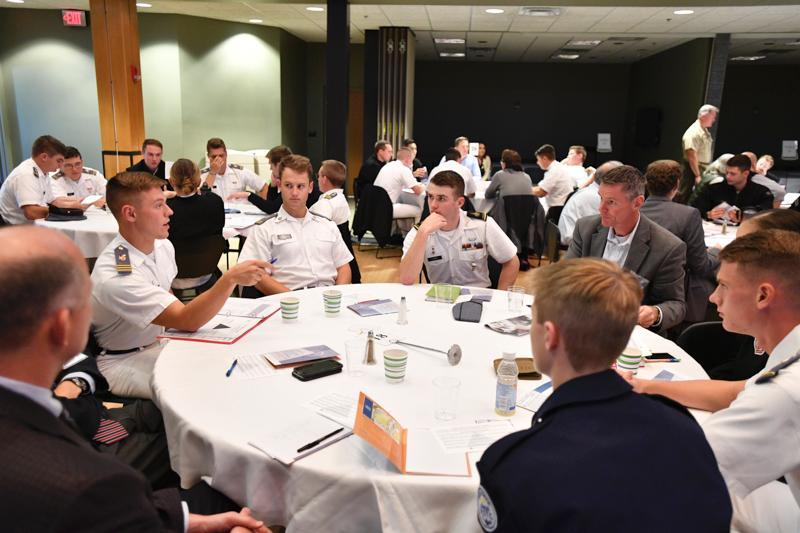 Cadets and visitors discuss the ethical implications of various scenarios at the ethical leadership challenge.