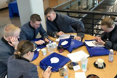 Cadets gather to discuss an ethical dilemma during the 2017 ethics bowl.