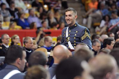 Ben Cross smiles after receiving his diploma in May 2013.