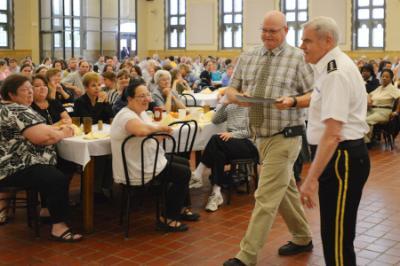 Edward Matheny receives an award at the 2016 staff breakfast.