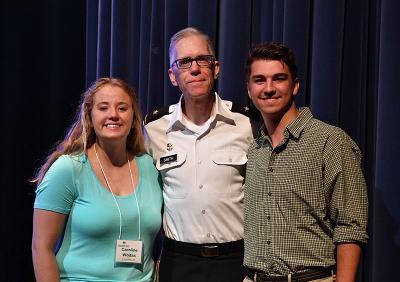 Two cadets pause with VMI's dean at the Shepherd Symposium.