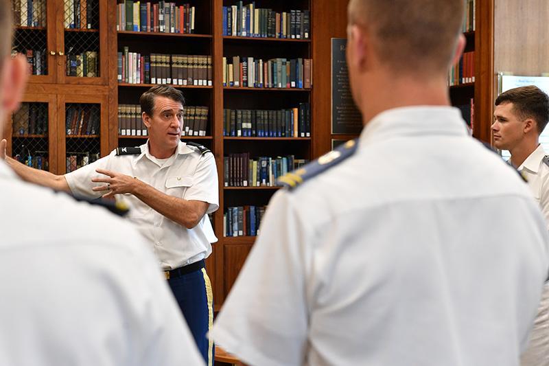 Col. Brad Coleman '95 leads cadets through the Marshall Library.