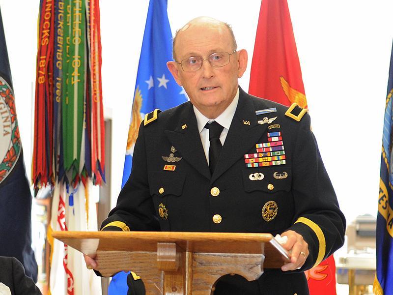 Brig. Gen. Mike Bissell '61 speaks during a ceremony honoring VMI alumni who are recipients of the Distinguished Service Cross.—VMI File Photo by Kevin Remington.