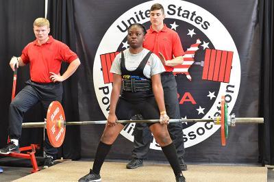 Cadet Holly Njabo '20 deadlifts during the powerlifting competition in Cocke Hall. 