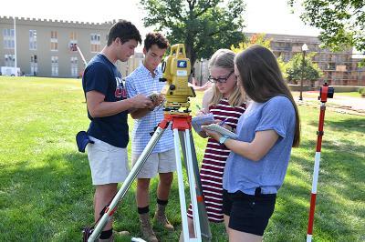 Four STP students take notes while surveying the Parade Ground.