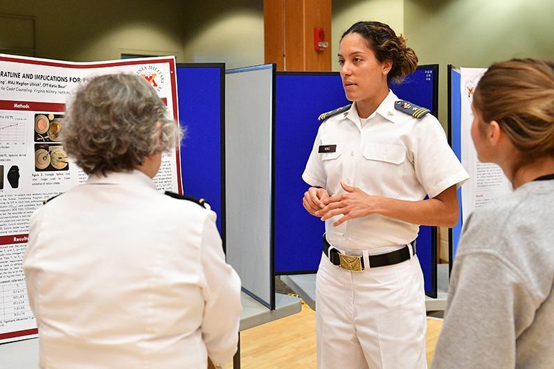 Bethany King ’18 presents her poster on the Rat Line caloric study during the undergraduate research symposium April 18.