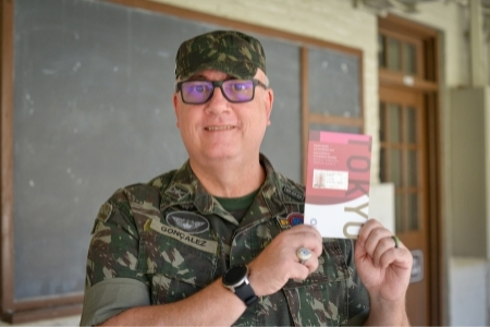 Col. Marcelo Goncalez, a member of VMI's Commandant's staff holds his credentials for the Tokyo Olympics.