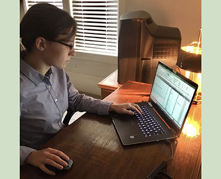 Josie Freeman '23 works on her laptop computer