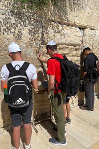 Sean Whearty ’22 praying at the Wailing Wall.—Photo courtesy of Cassidy Dufour ’23.