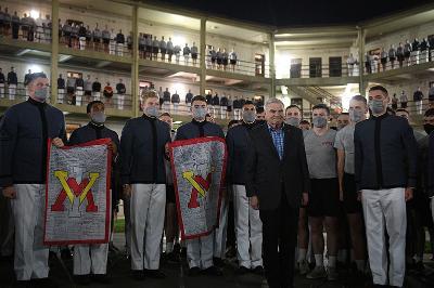 Gen. J.H. Binford Peay III '62 bids farewell to the Corps of Cadets, and is presented flags signed by each class.