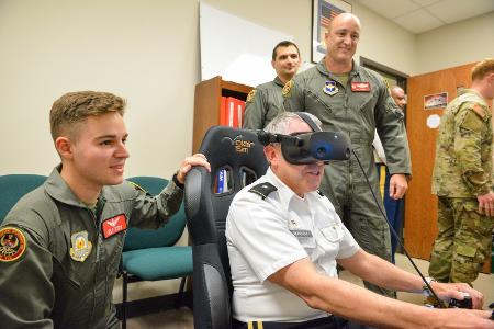 Brig. Gen. Moreschi, dean of faculty, takes his turn on the latest flight simulator equipment during a  visit with Air Force ROTC